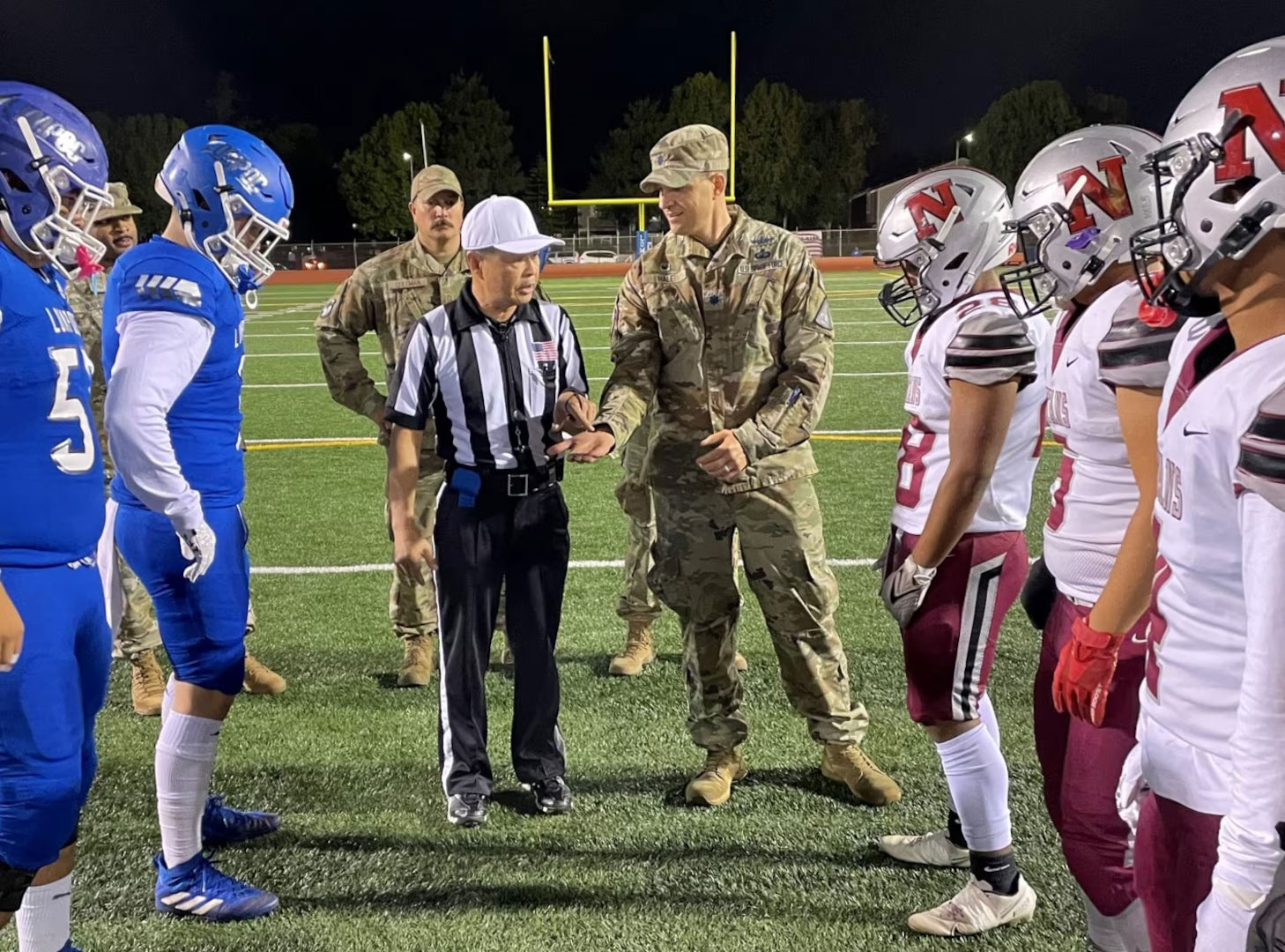 Photo: (l-r) Sharpe, Coleman, and Hale at the pregame coin toss.